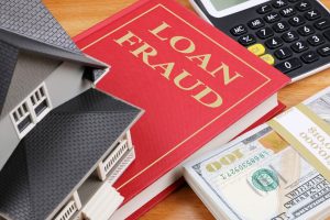 photo of a house and a book on loan fraud